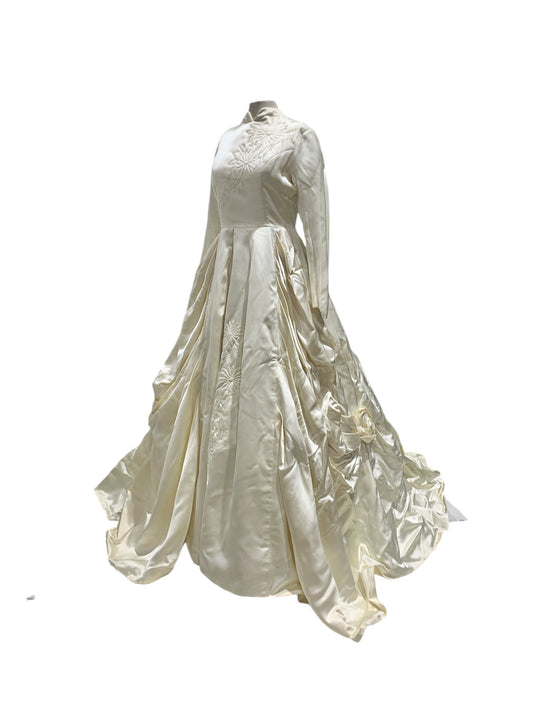 1961 Ivory Satin Long-Sleeved Gown with Draped Sides, Swan-neck Collar, and Flower Accents